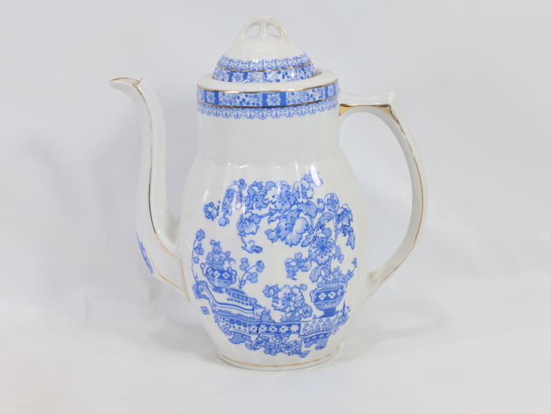 Porselens kanne med blått blomstermotiv