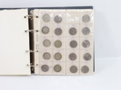 Myntalbum med diverse mynt