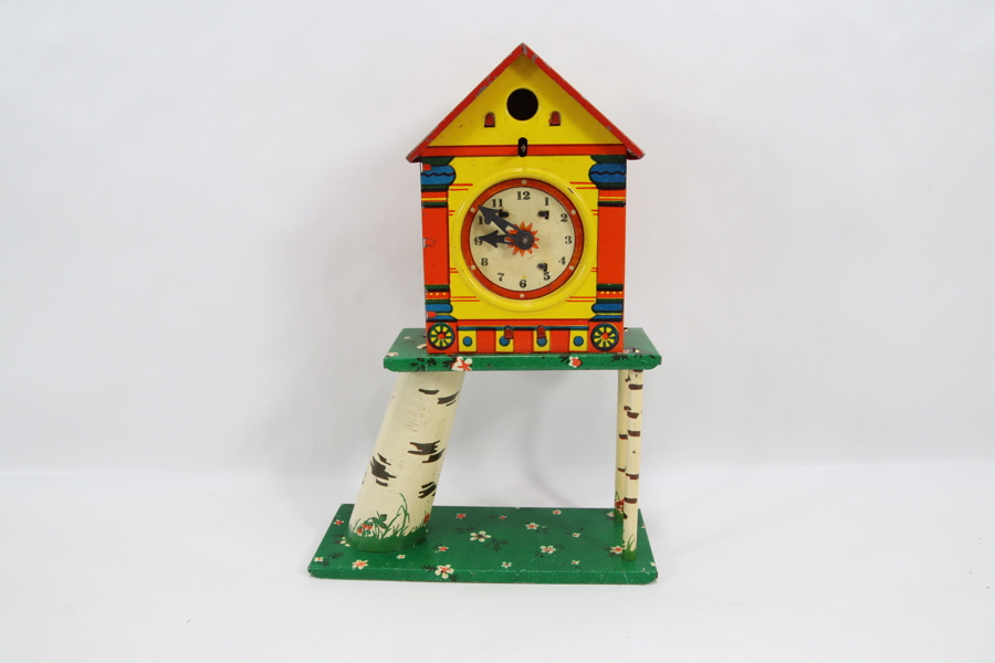 Tysk blikkleke – dekorativ fuglehus-klokke med stativ
